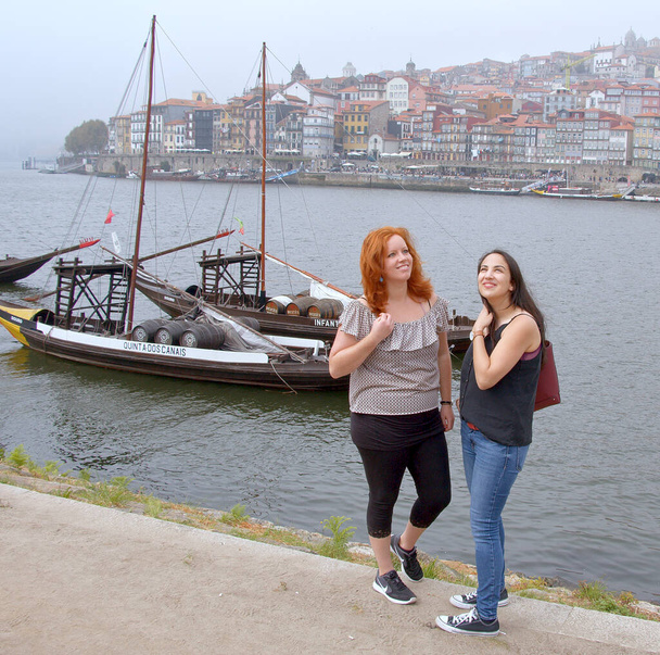 Two girls explore the city of Porto in Portugal - 写真・画像