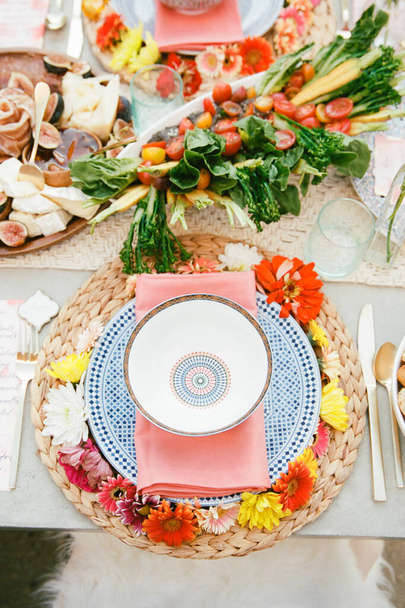 Blue colored patterned tableware set up for a summer dinner outside - Photo, Image