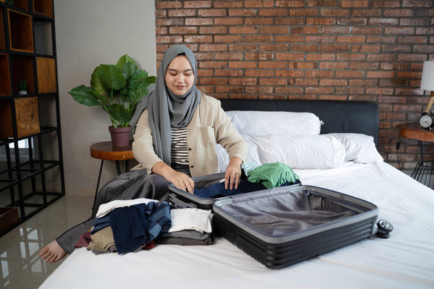 muslim asian woman prepare clothes - Fotó, kép