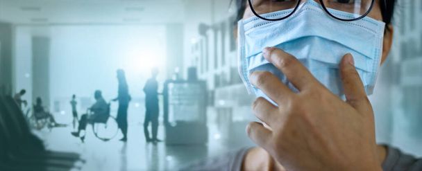 Women wearing virus mask protect of infection and spreading Coronavirus or Covid-19 and patients come to the hospital on background. - Фото, зображення