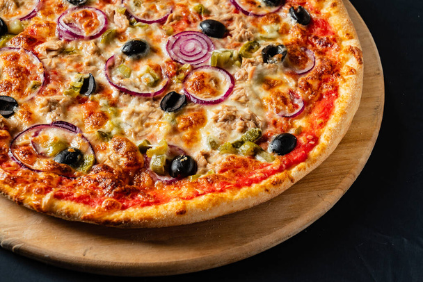 pizza on the black background - Фото, изображение