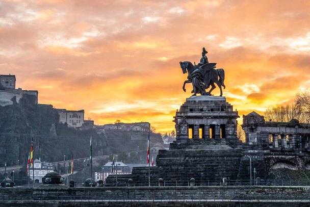 Colorful Sunrise burning sky Koblenz City historic monument German Corner where river rhine and mosele flow together - Фото, зображення