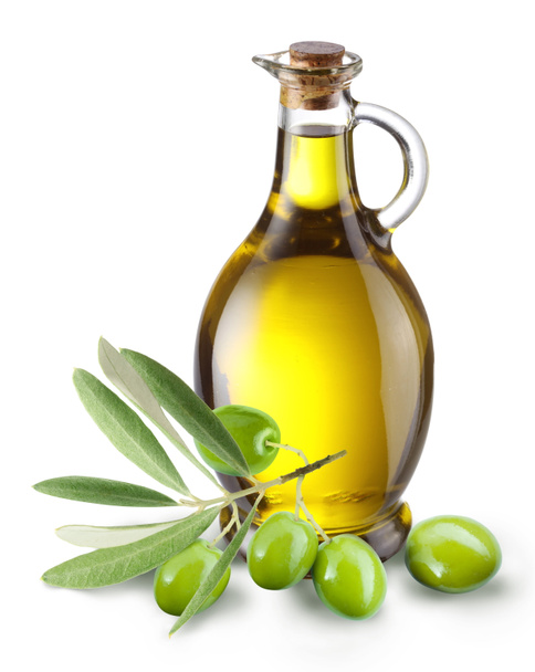 Branch with olives and a bottle of olive oil. - Фото, изображение