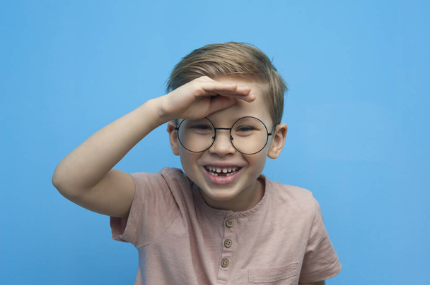 Portrait of a laughing little boy with glasses - Photo, image
