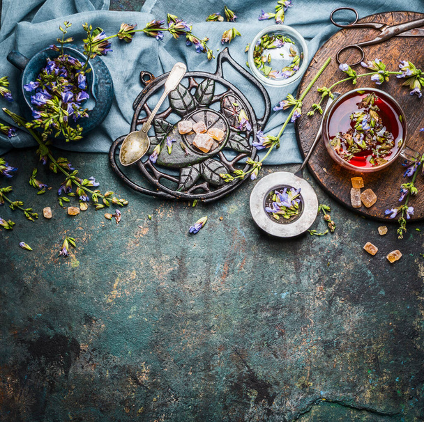 Organic herbal tea making with fresh detox herbs and flowers on rustic background, top view, border. Healthy, diet or detox drink - Photo, Image