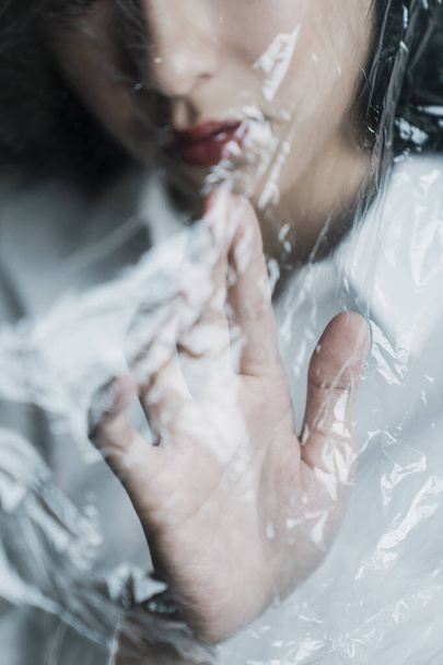 Cropped image of woman's hand touch the plastic bag. - Photo, Image