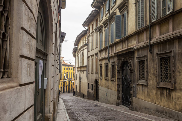 Bergamo, Italy, February 16, 2020. Picturesque narrow street in the Lower City (Citta Bassa). - Фото, изображение