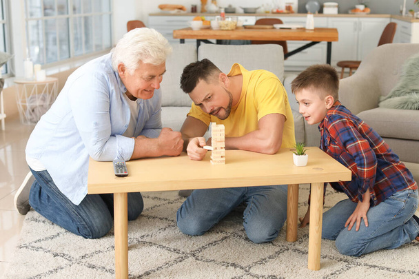 Man with his father and son spending time together at home - Photo, Image