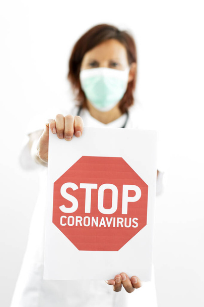 Doctor holding a stop coronavirus sign in hospital - Zdjęcie, obraz