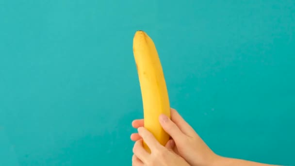 Close up of banana representing man penis while masturbating - Materiał filmowy, wideo