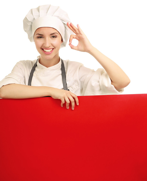 Chef woman holding a blank board and showing ok - Fotoğraf, Görsel
