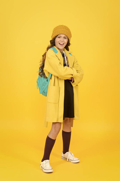 Outfit for daily school life. Feeling cool and stylish. Fall fashion. Little girl wearing stylish hat and coat. Schoolgirl fancy child. Aesthetics of clothes. Fall outfit. Modern teen outfit concept - Photo, image
