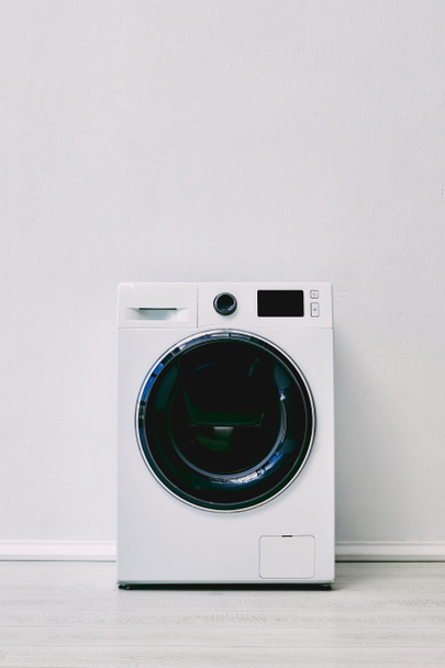 washing machine near white wall in bathroom  - Φωτογραφία, εικόνα