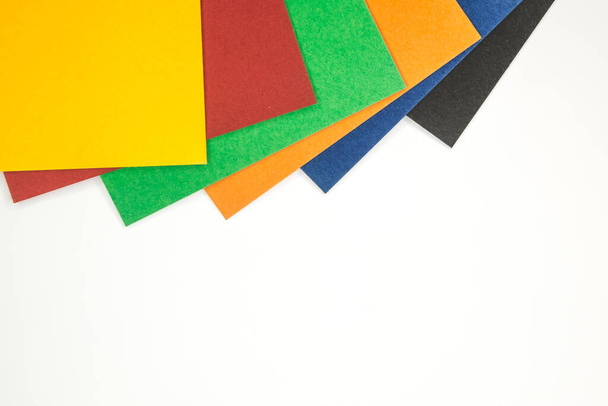Sheets of colored paper on white background - Valokuva, kuva