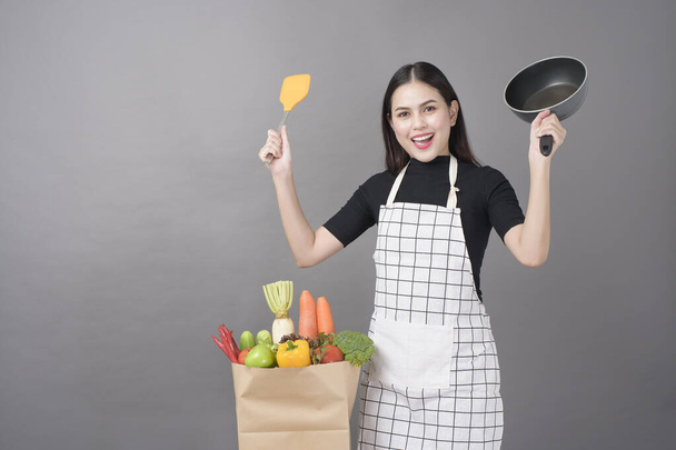 Happy woman is preparing healthy food to cooking - Zdjęcie, obraz