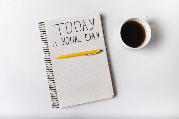 Motivational inscription in notepad TODAY IS YOUR DAY. Coffee, notebooks and pen. Handwriting. - Fotoğraf, Görsel