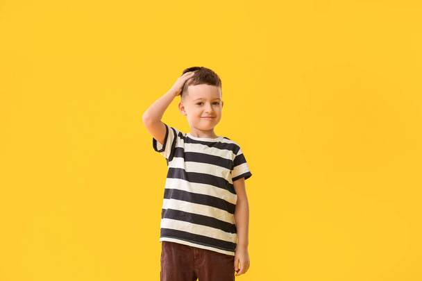 Cute little boy on color background - Foto, imagen