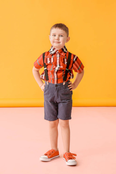 Cute little boy on color background - Photo, Image