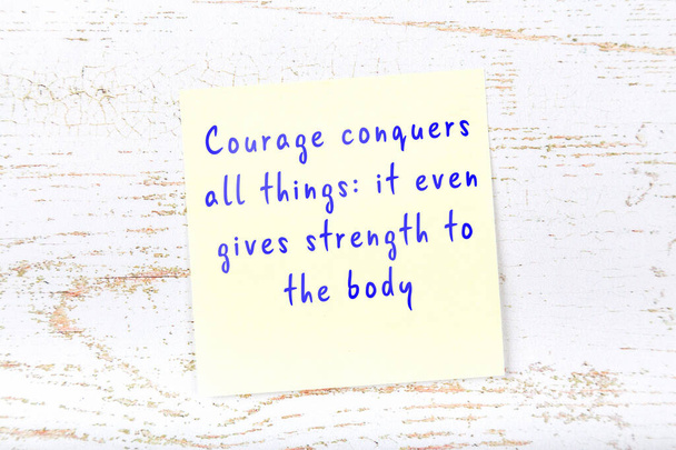 Yellow sticky note with handwritten motivational quote - Photo, Image