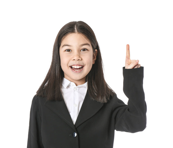 Cute little businesswoman with raised index finger on white background - Photo, Image
