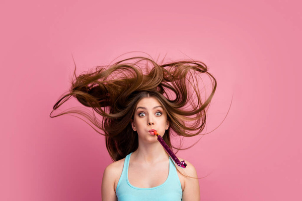 Portrait of her she nice-looking attractive lovely charming funny comic cheerful cheery straight-haired girl blowing whistle having fun ideal silky hair flying isolated on pink pastel color background - Foto, Imagen