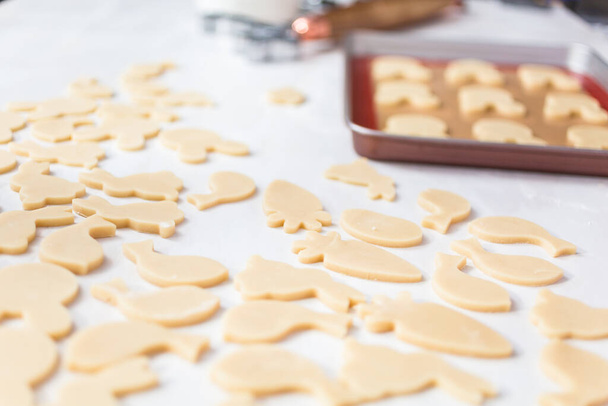 Unbaked Easter sugar cookies on a white table. - Foto, immagini