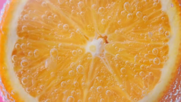 image en gros plan de fruits orange, fond dans l'eau, sous l'eau
. - Séquence, vidéo