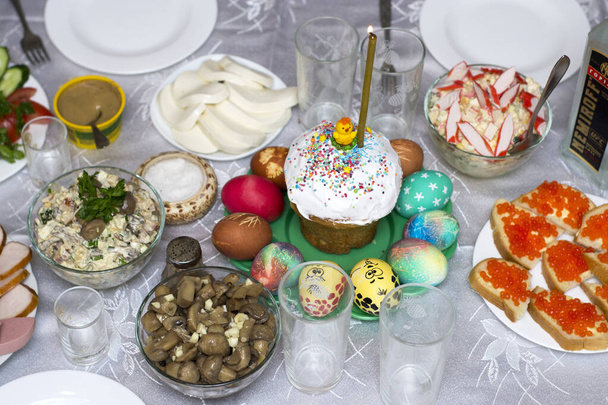 Serving Easter table with tasty dishes on room background - Foto, Bild