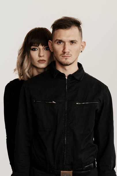 Millennial fashion couple on a white background in studio - Photo, image