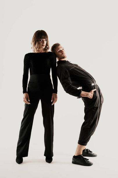 Millennial fashion couple on a white background in studio - Foto, afbeelding