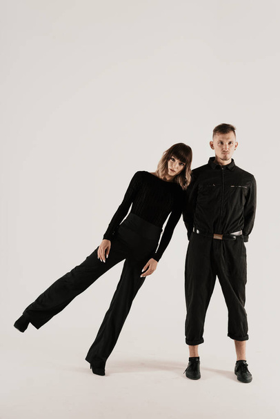 Millennial fashion couple on a white background in studio - Valokuva, kuva