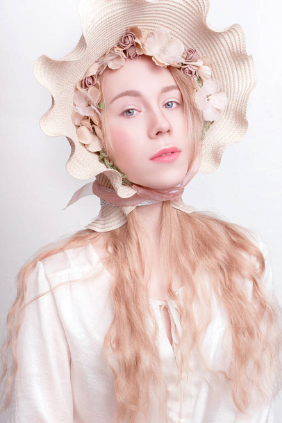 beautiful spring girl wearing flowers hat, looks like camomile, fashion retouched portrait - Foto, Imagem