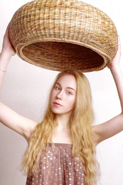 Beautiful peasant girl holding a basket, fashion retouched portrait - Fotó, kép