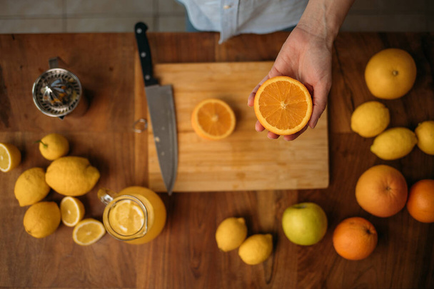 Top shot of a woman preparing homamede juice from various fruit - Photo, Image