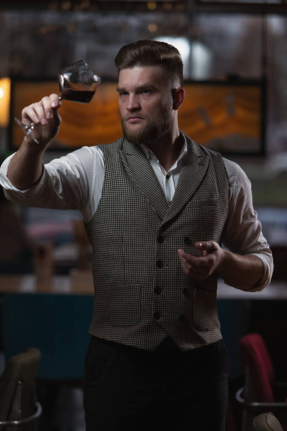  Sommelier guy with a glass of red wine - Photo, Image