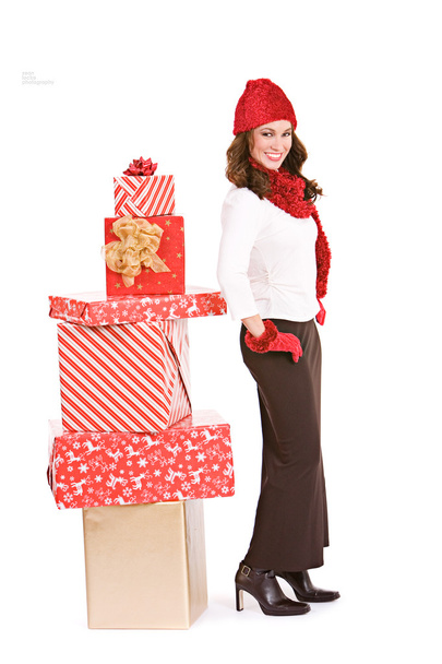 Christmas: Winter Woman Standying By Stack of Gifts - Fotoğraf, Görsel