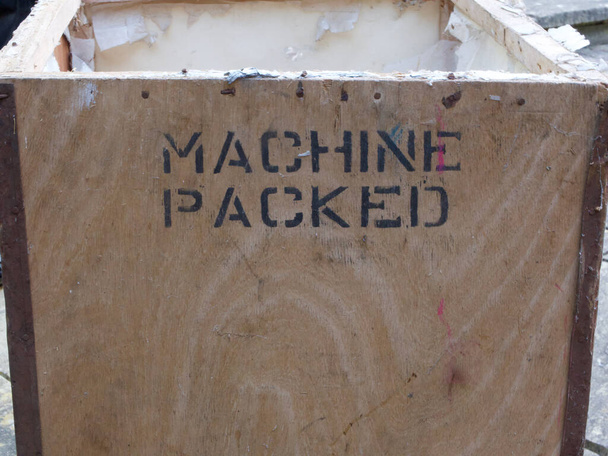 Tea chest with words machine packed stencilled on wood - 写真・画像