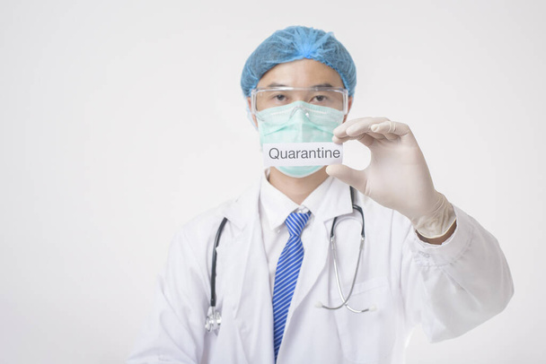 Doctor is holding quanrantine card on white background  - Zdjęcie, obraz