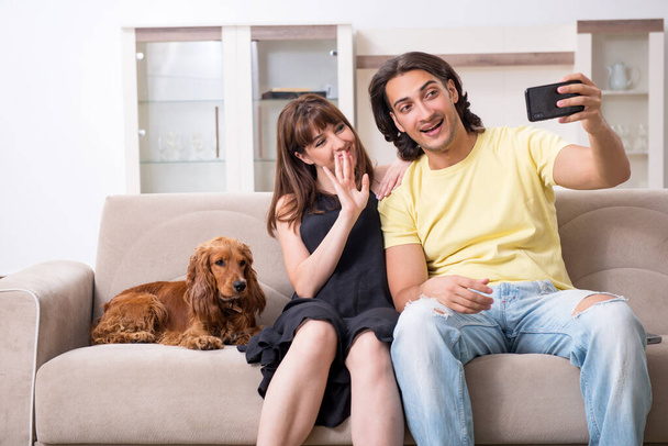 Young couple with cocker spaniel dog - Photo, Image