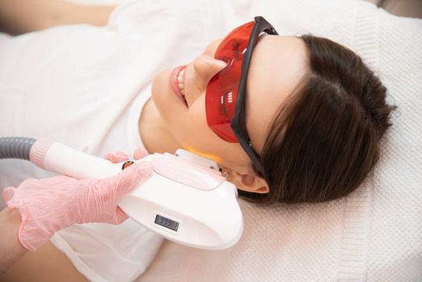 Removal of unwanted hair laser Epilation on face mustache young woman. Concept beauty and health - Photo, Image