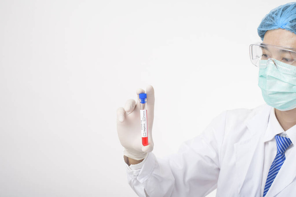 Doctor is holding infected  covid-19  blood test  on white Background  - Fotó, kép