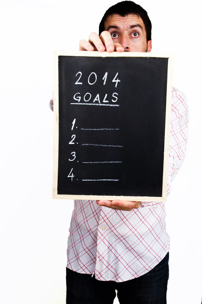 Geschäftsmann hält Stammtisch mit Zielen für das neue Jahr 2014 - Foto, Bild