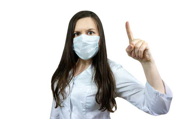 Covid19, coronavirus, woman doctor point finger with idea, wear medical mask to prevent catching virus, white coat. - Φωτογραφία, εικόνα