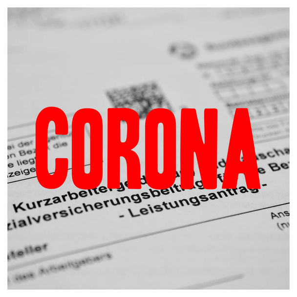 German application form short-time allowance, with with a large imprint "corona" in German. Translated: Application for short-time allowance for employees in companies - Photo, Image