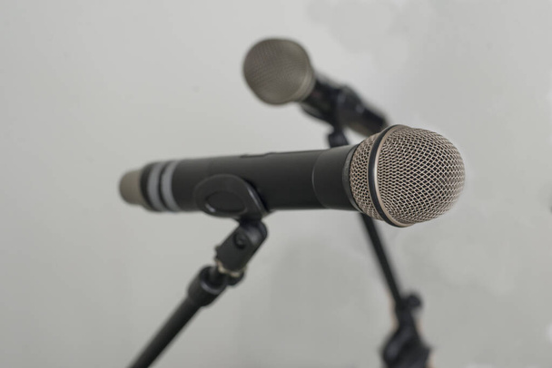 Two microphones ready for speakers. - Photo, Image