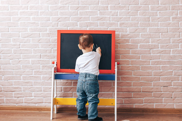 Child at the blackboard - Photo, Image