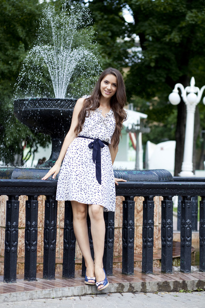 Happy young woman in sexy white dress - Zdjęcie, obraz