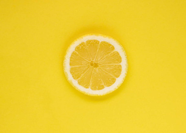 lemon, summer fruit, isolated on yellow background - Foto, afbeelding