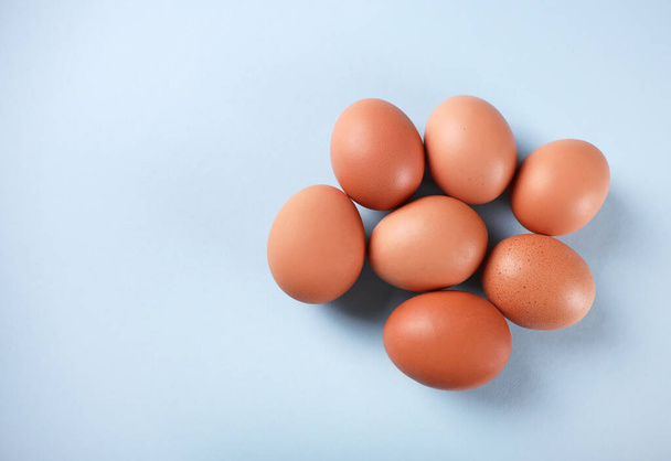 Fresh eggs on blue background - Photo, Image