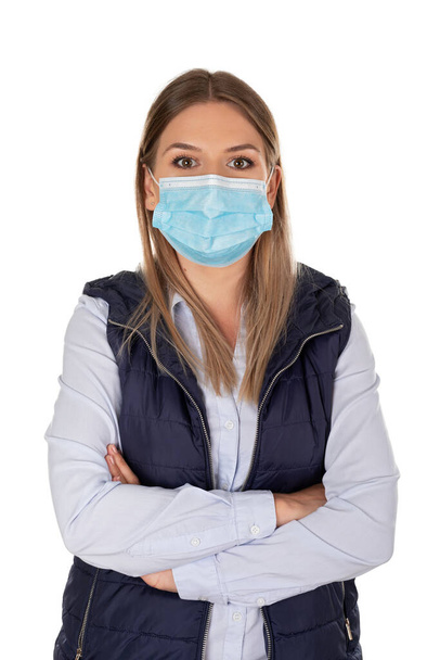 Beautiful caucasian woman wearing protective face mask , posing on isolated background - Foto, immagini